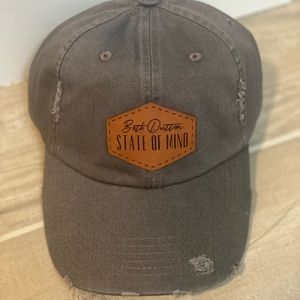 Grey distressed women’s minimalist baseball hat. Custom patch, Yellowstone.